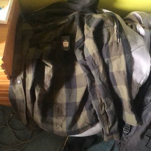 This is a No boundaries NB hooded flannel in dark green and black